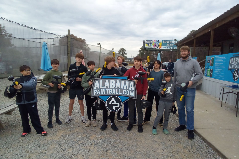 A group of young players outside the park