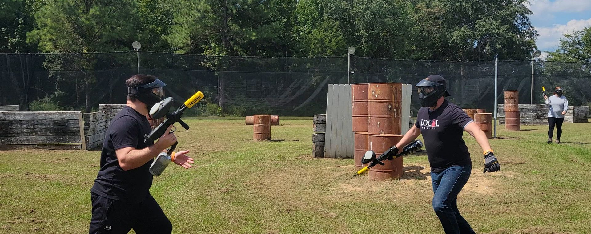 Two players mid-game at an Alabama Paintball park
