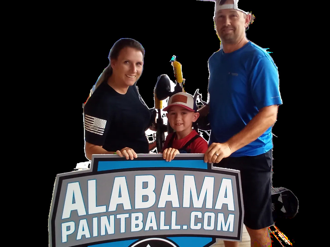 A family at the Alabama Paintball 280 party space after a birthday session