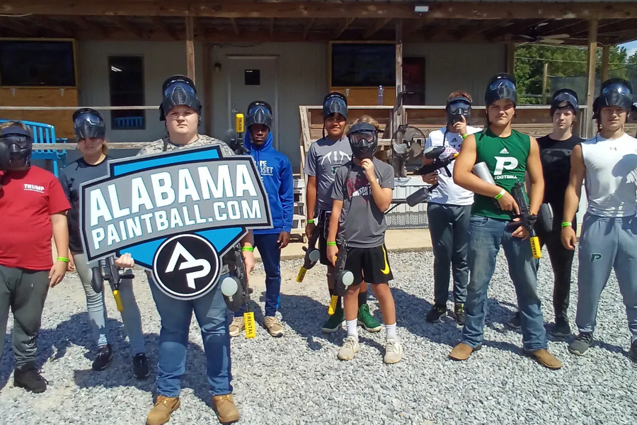 A company group outside the Central Alabama Paintball building