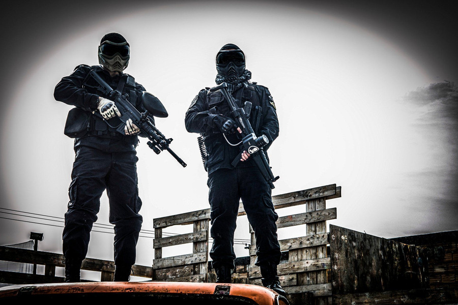 Two self-equipped players in full gear at Alabama Paintball Quest